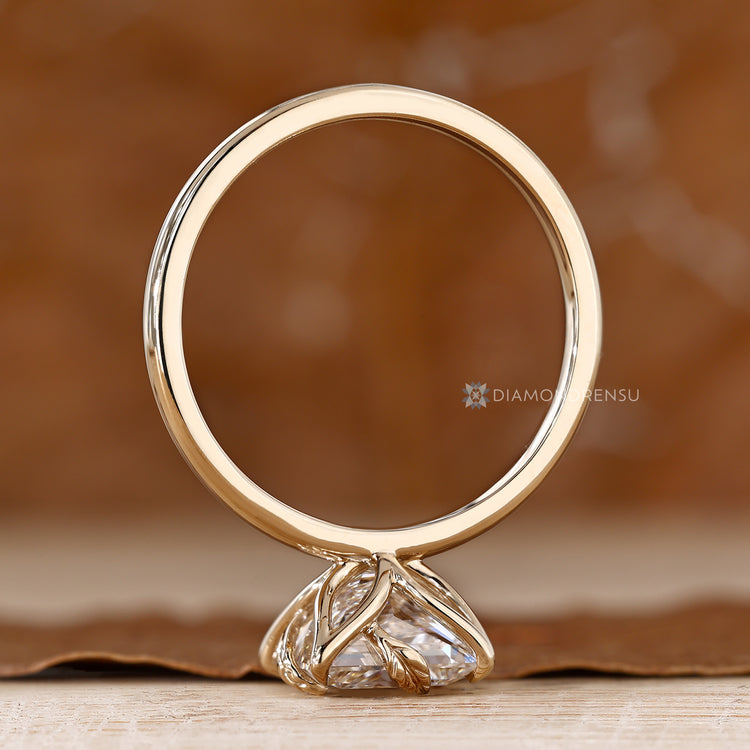 Nature inspired ring with princess cut centre diamond.