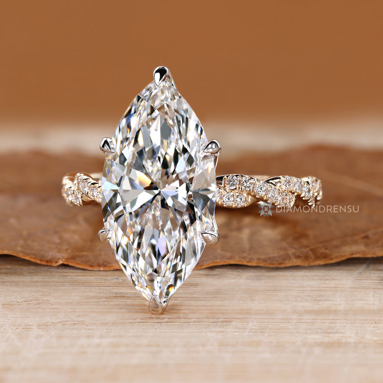 IGI certified marquise diamond ring with round side stones.