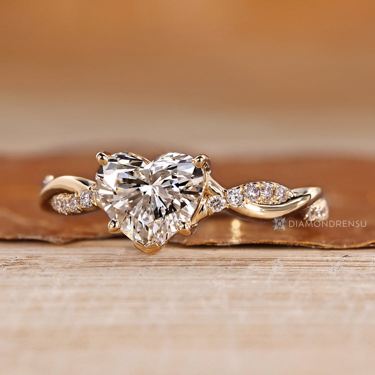 Pave ring with twisted shank and four prong setting.