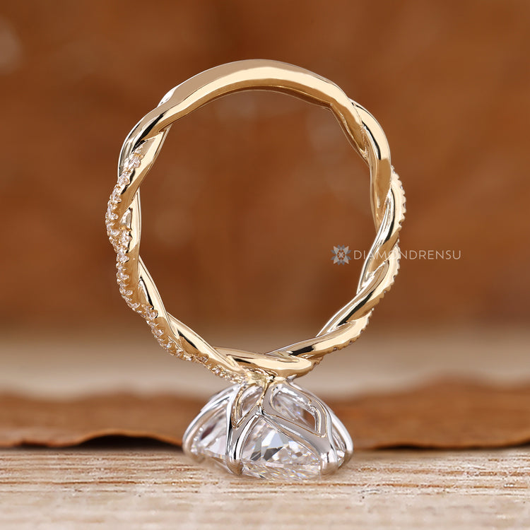 Six claw prong marquise ring with twisted shank.
