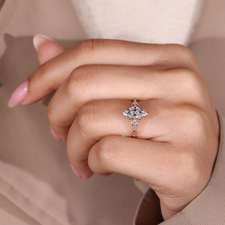 Handmade marquise ring with four claw prong setting.