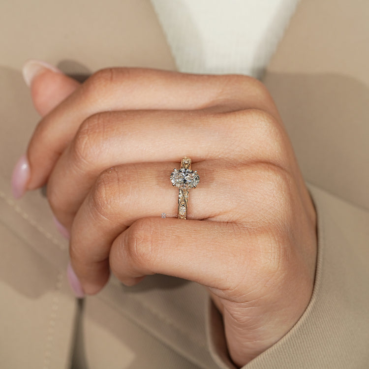 Oval engagement ring with round diamond hidden halo setting.