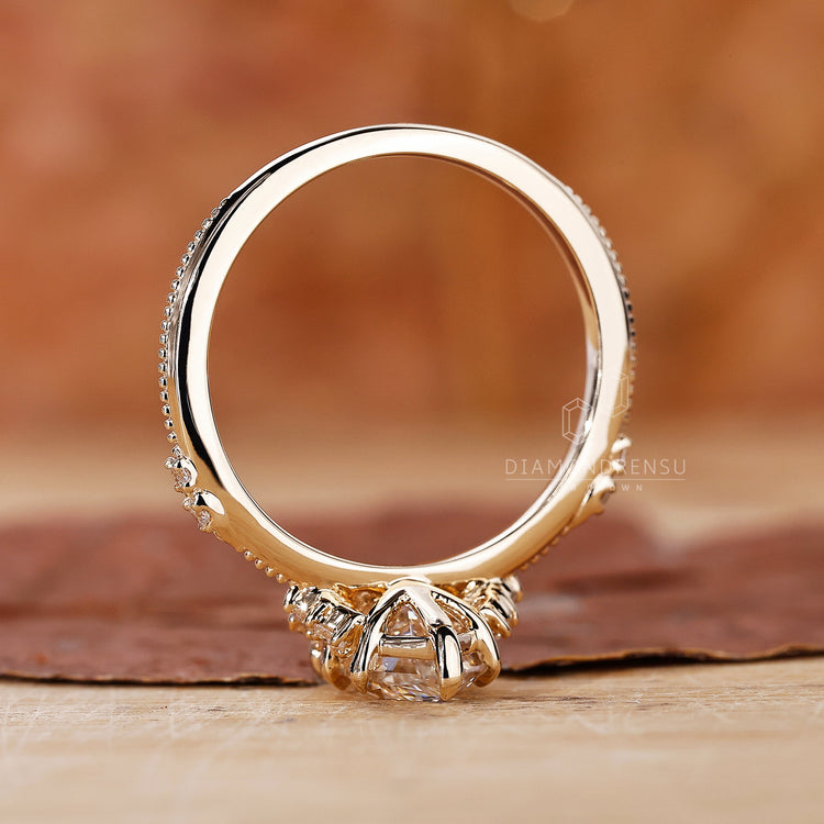 Vintage style dutch marquise ring with round diamond accents.