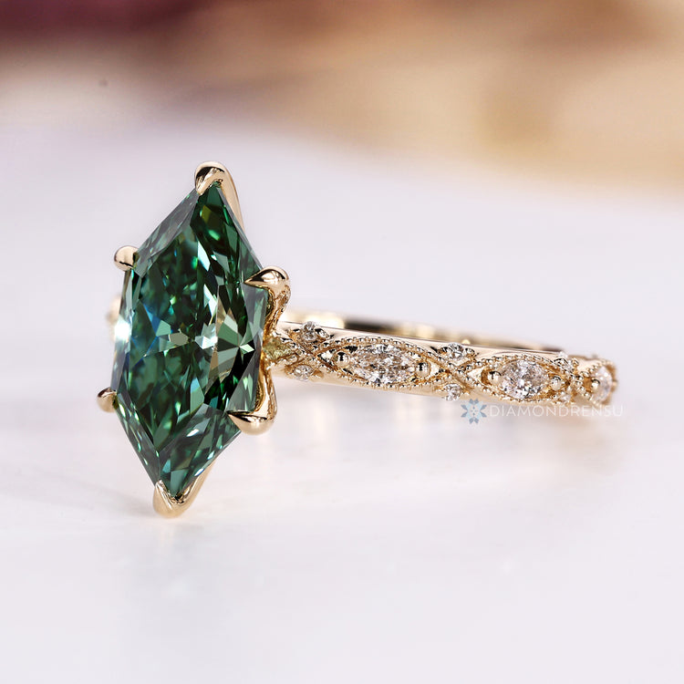Green Dutch marquise ring with milgrain details.
