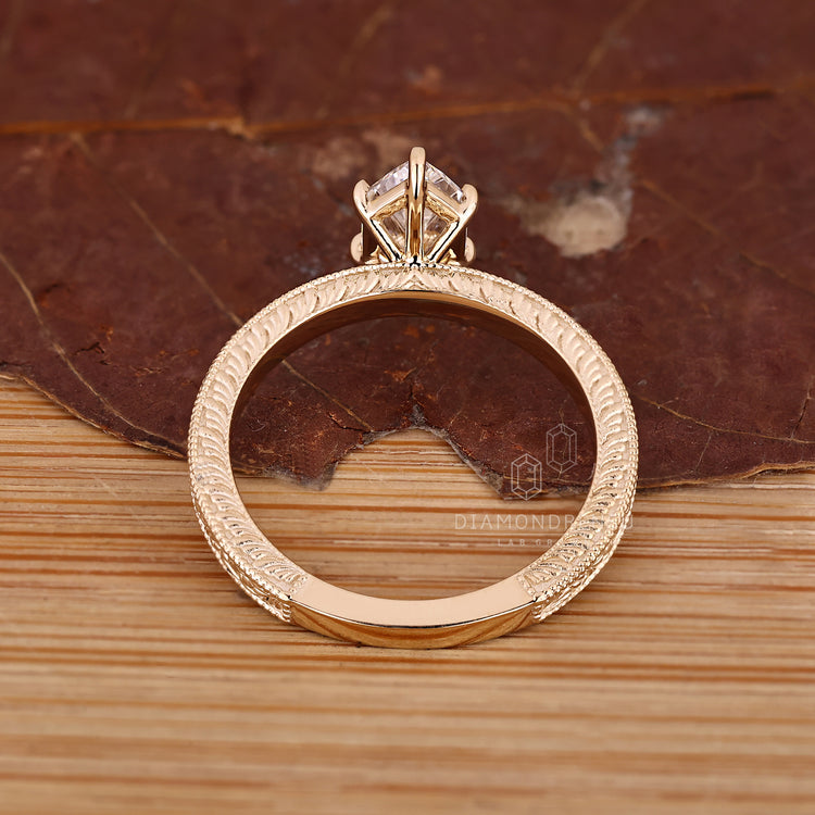 Solitaire marquise diamond ring with six claw prong setting.
