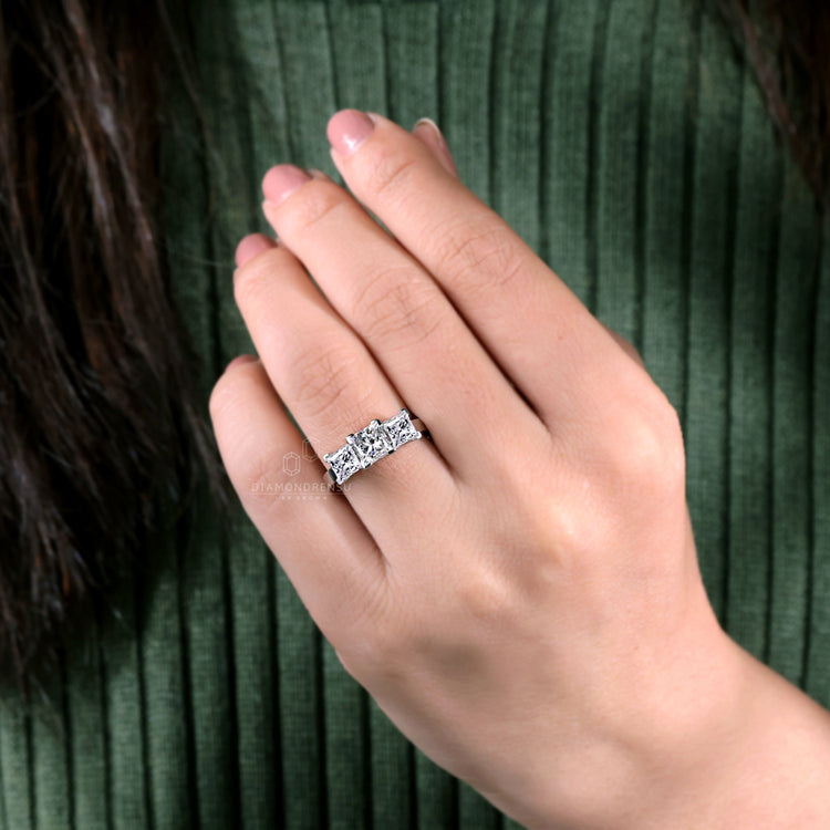 Ring three stones in a modern basket setting for elegance.