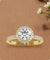 Round Cut Diamond With Halo Setting and Pave Ring in Yellow Gold.