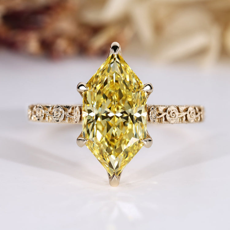 Nature inspired engagement ring with yellow Dutch marquise diamond.