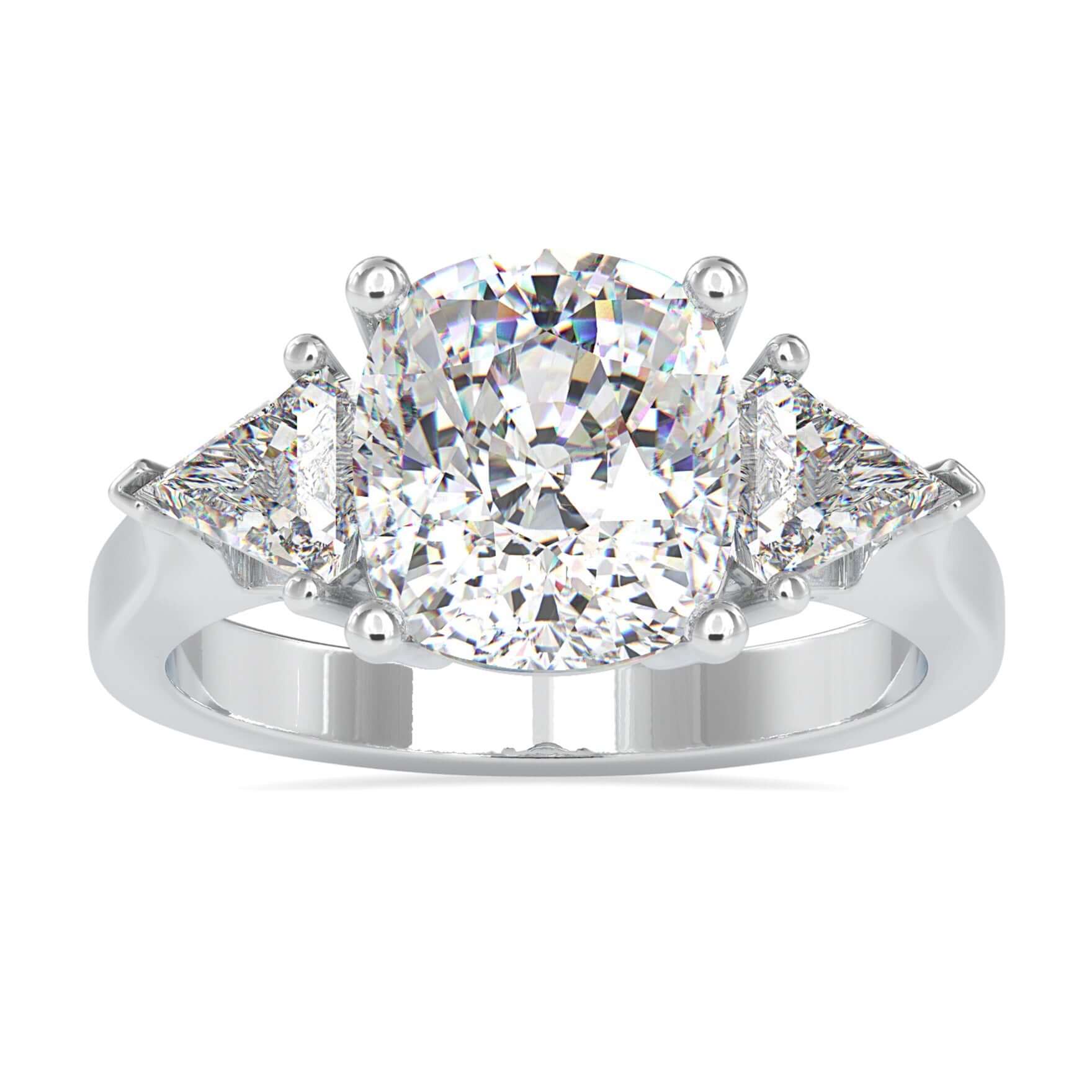 Cushion cut diamond ring with two kite cut side stones in white gold.