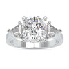 Cushion cut diamond ring with two kite cut side stones in white gold.
