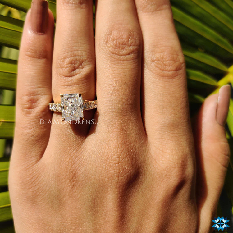 Yellow gold engagement ring with four prong mount.