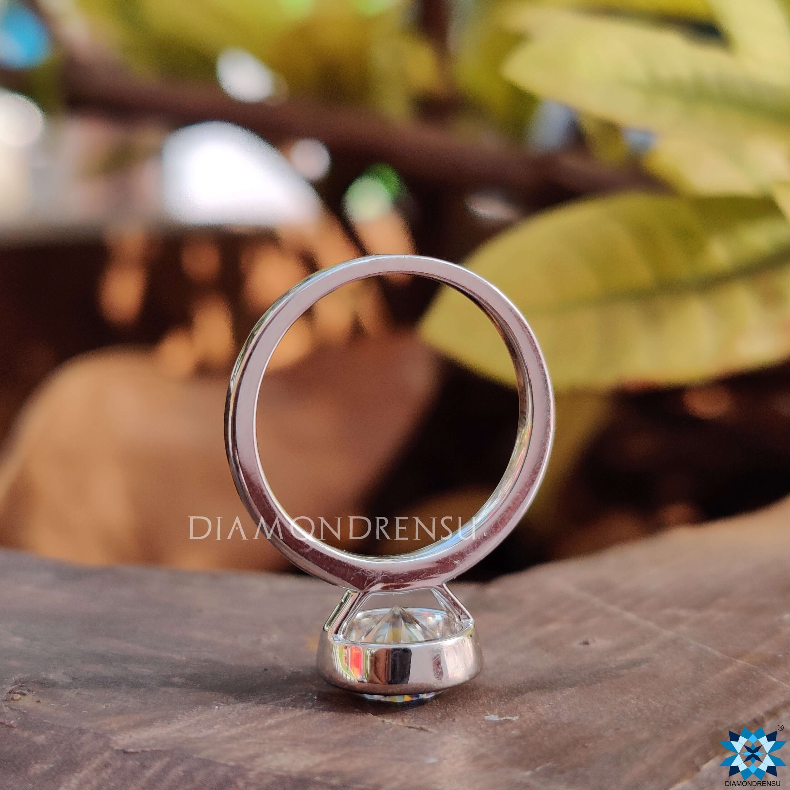 Handmade jewelry with round cut Moissanite and secure bezel setting.