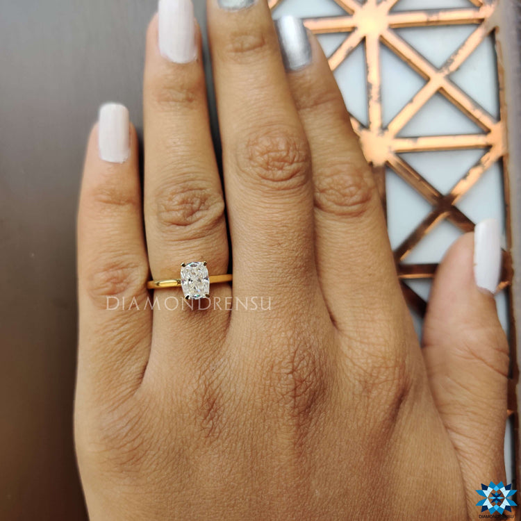 UK handmade engagement ring with fine claw prongs and clean lines.