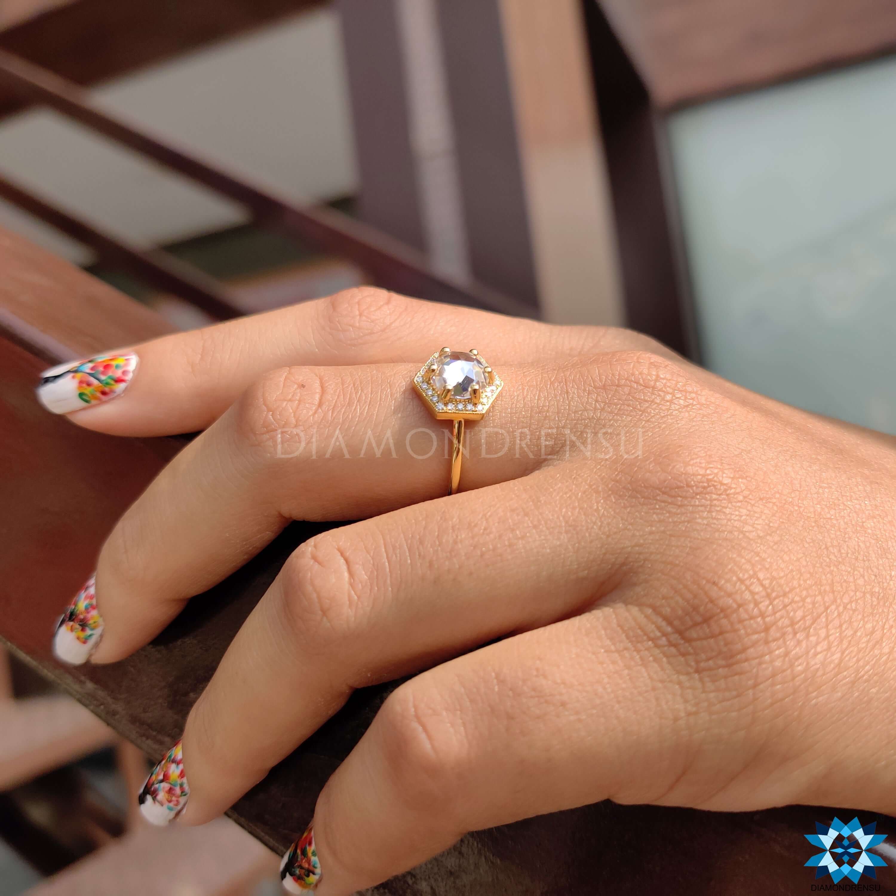 Custom halo engagement ring with hexagon frame.