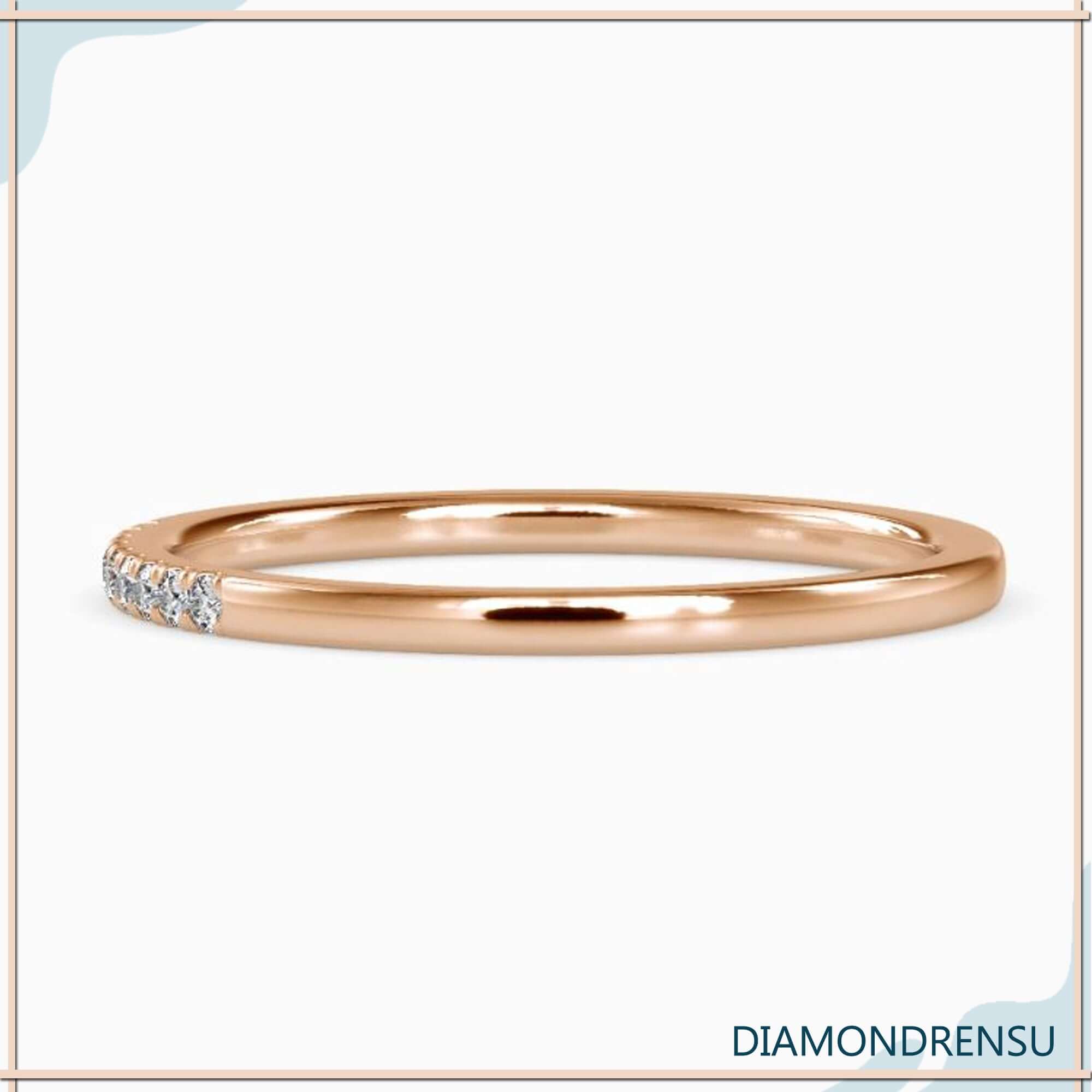 White gold wedding band featuring 1/4 eternity diamond row.