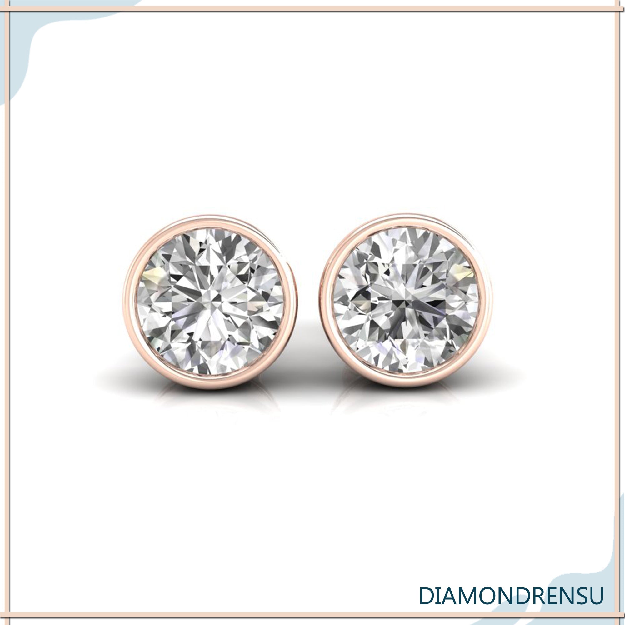 Gold diamond earrings with bezel setting and round cut stones.