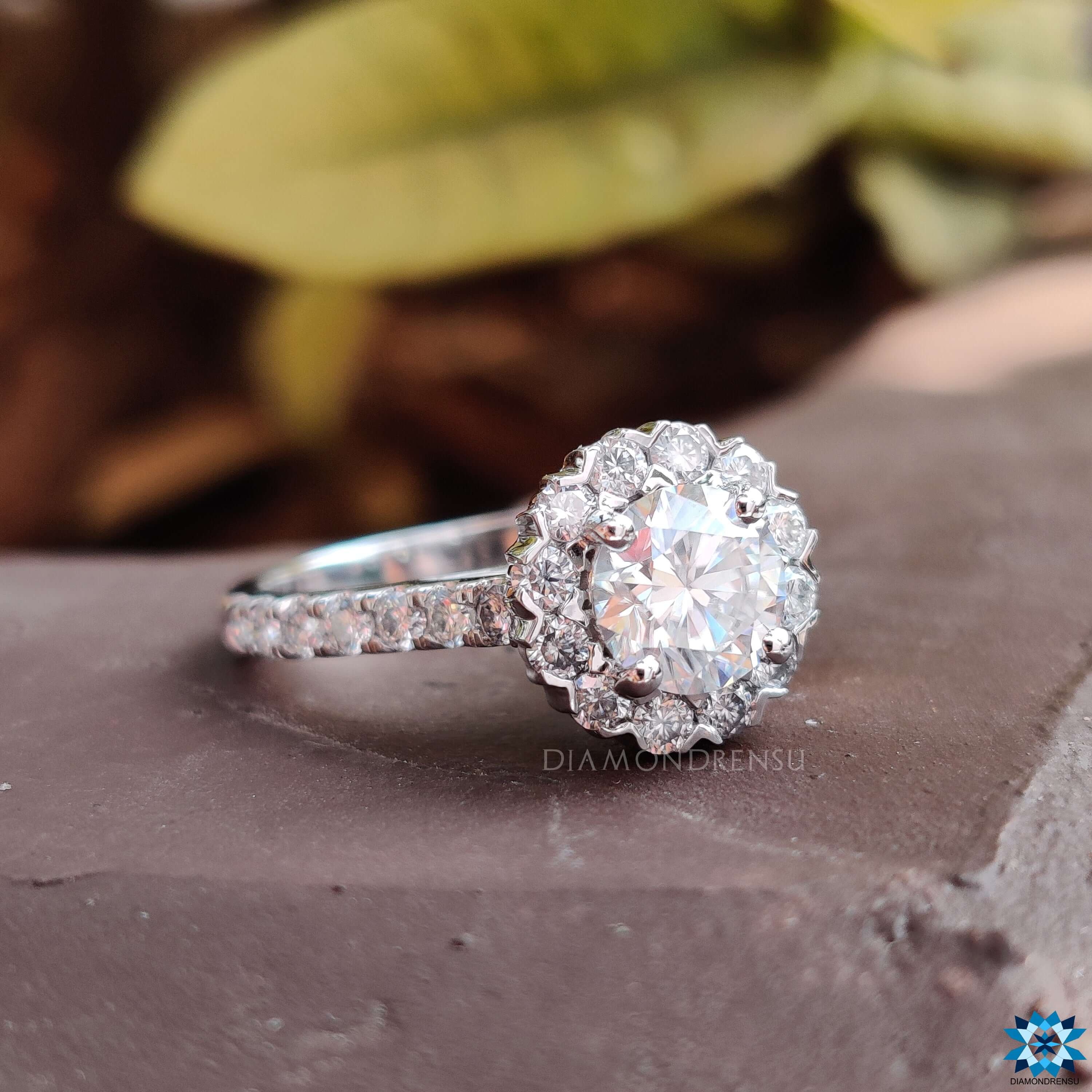 Classic 4 prong ring setting securing the dazzling moissanite stone.