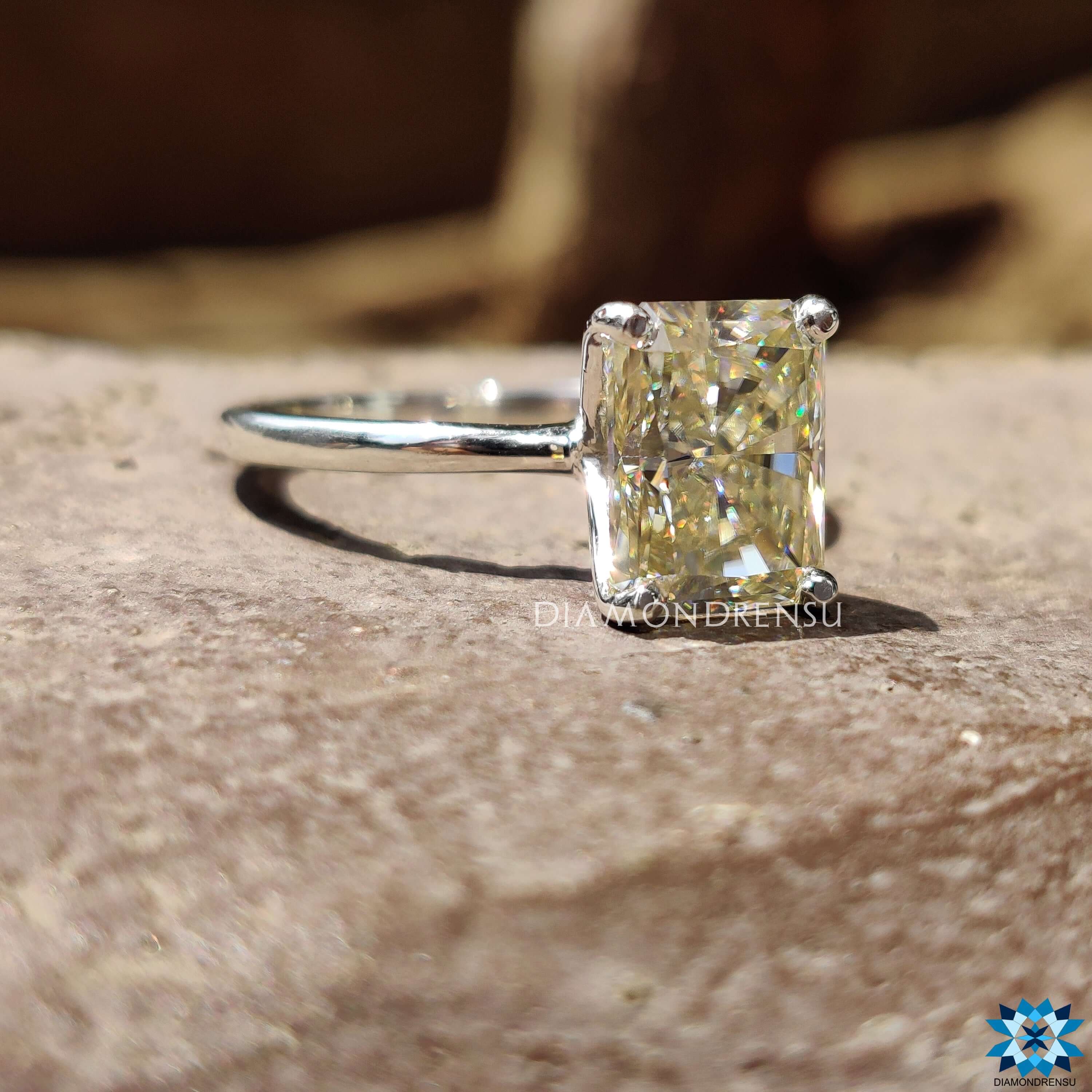 White gold ring with radiant cut moissanite and 4 prong setting from Diamondrensu UK.