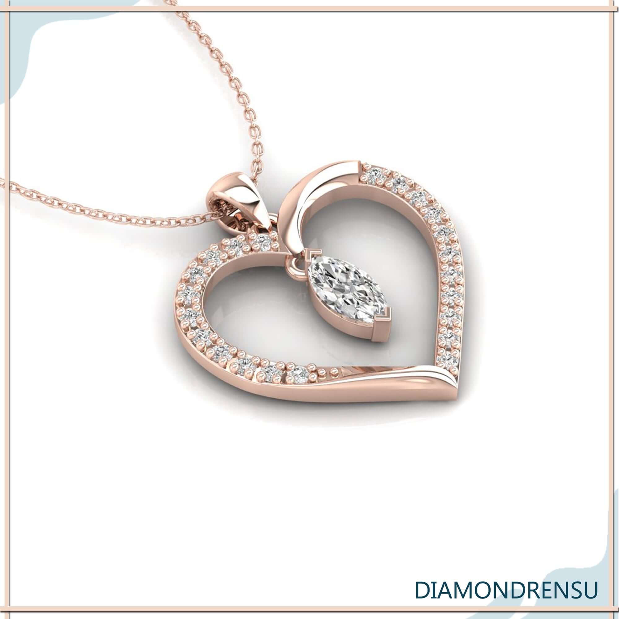 Round cut outline pendant featuring marquise diamond in the centre.