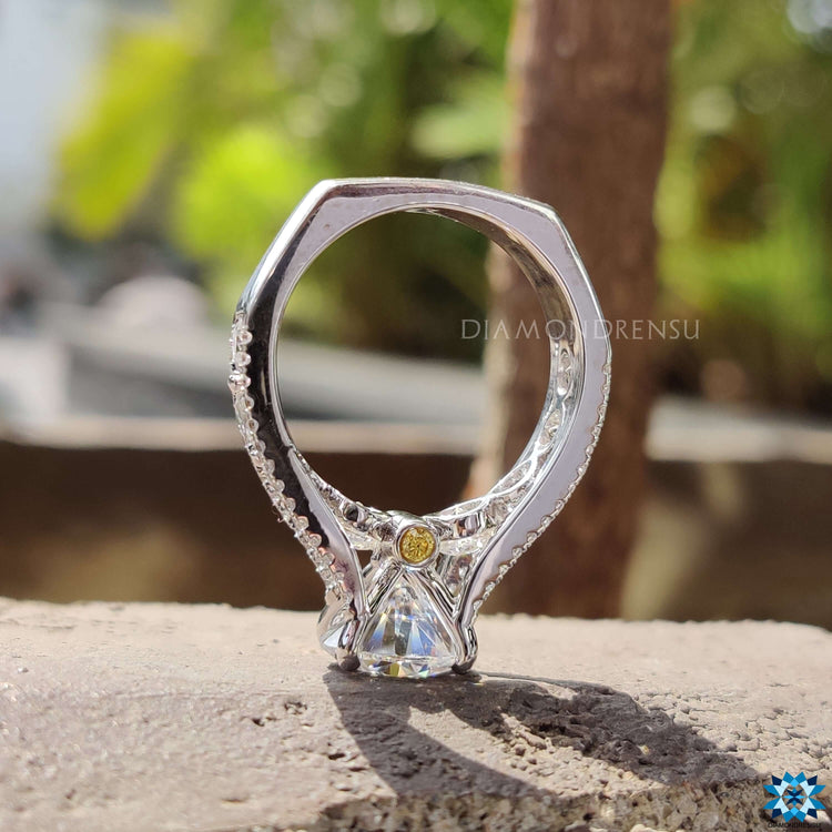 Handmade round cut engagement ring with vintage style.