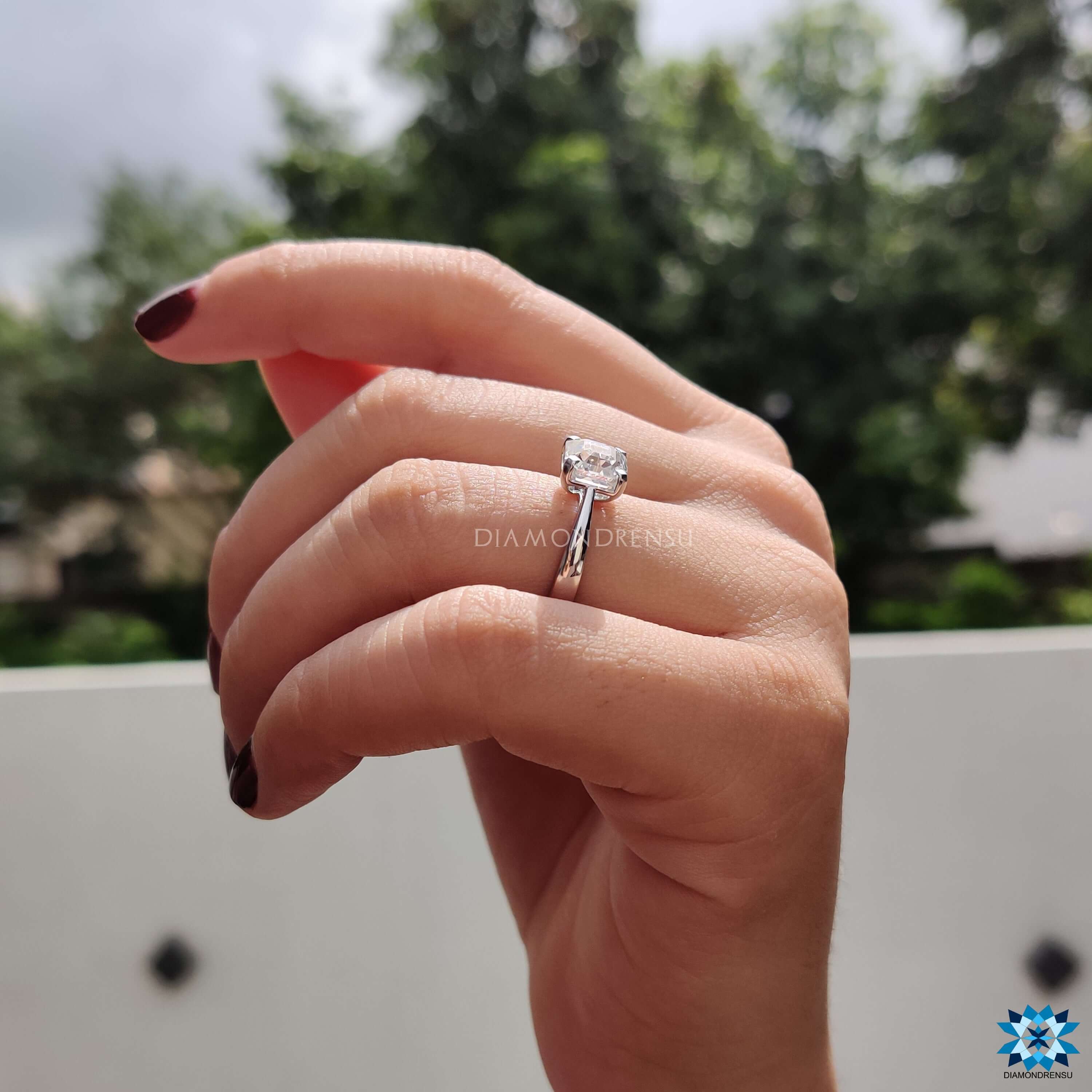 Prong setting ring with octavia cut moissanite center.