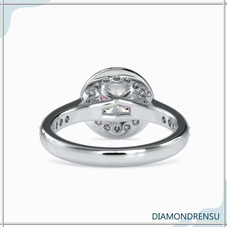 Custom engagement ring with halo round diamond and four prongs.