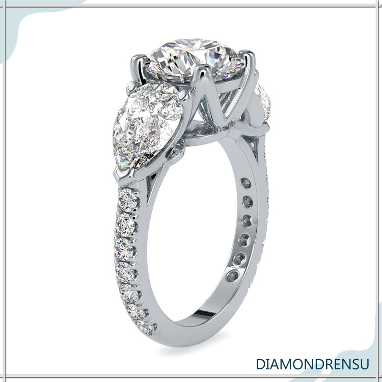 Round cut diamond ring with four-prong setting detail.