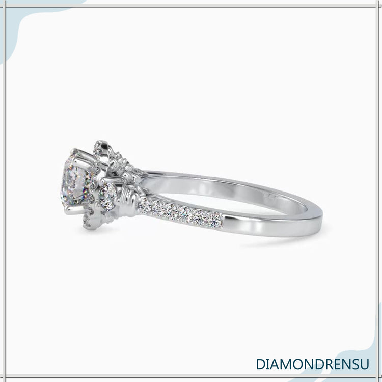 UK engagement ring featuring floral pave diamond band.