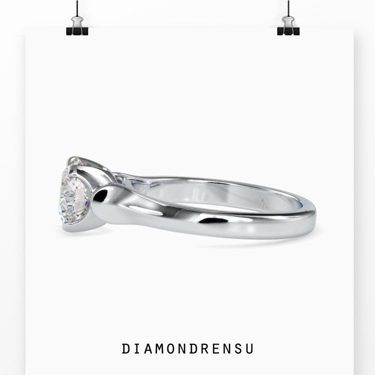 Rose gold ring with round diamond in solitaire setting.