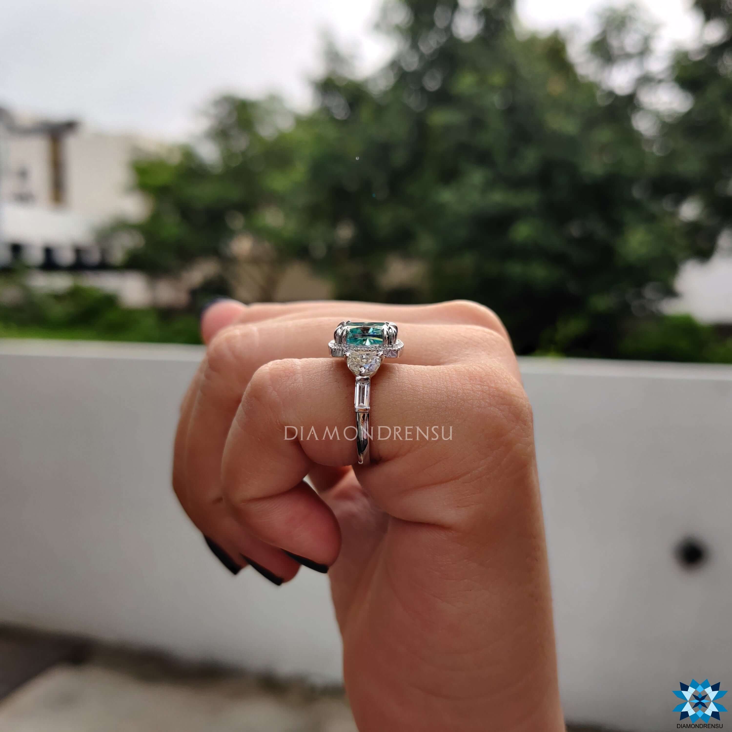 Cushion halo moissanite ring with half moon and baguette side stones.