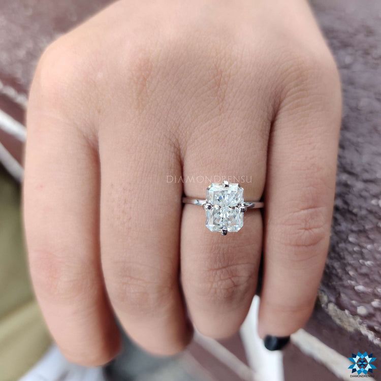 Radiant cut moissanite ring in white gold.