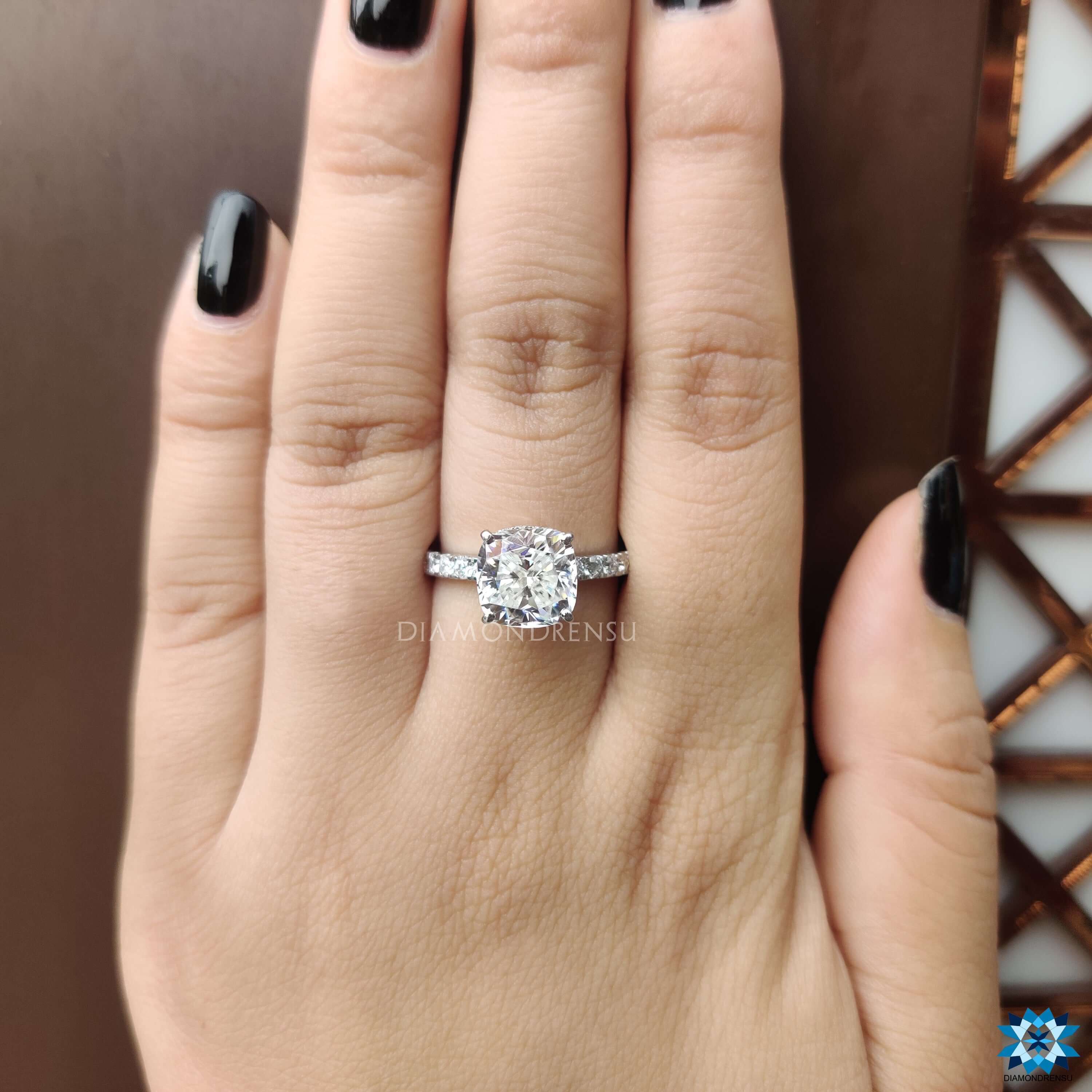 Pave setting moissanite ring with double halo design.