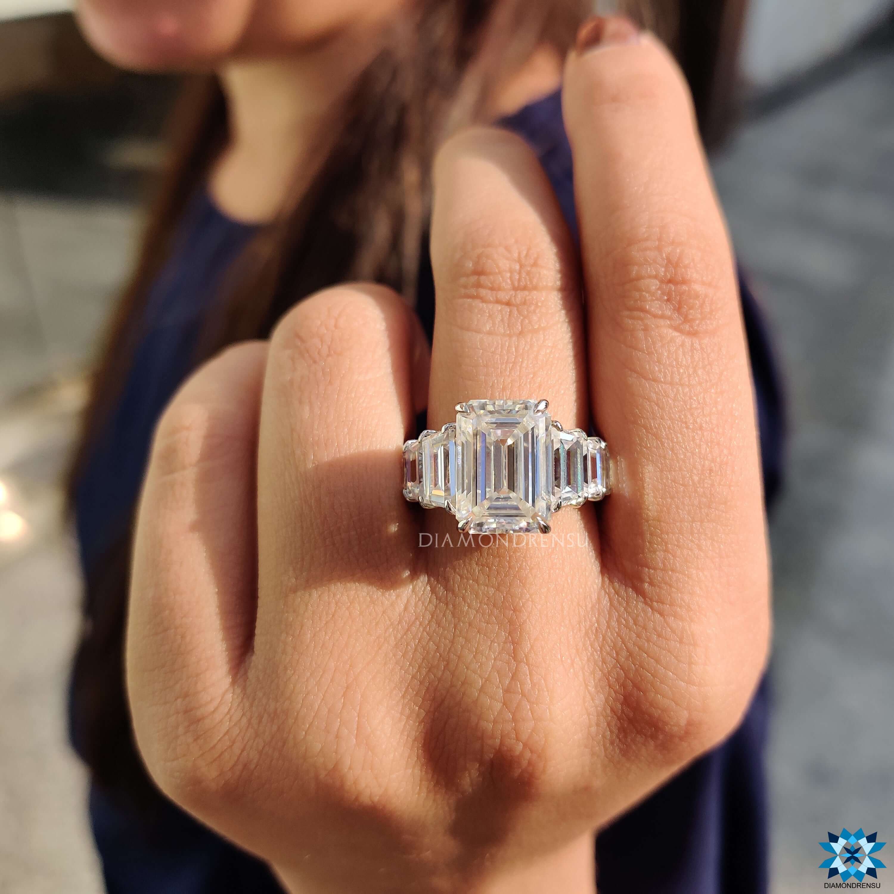 Vintage-inspired emerald cut ring featuring pave band.
