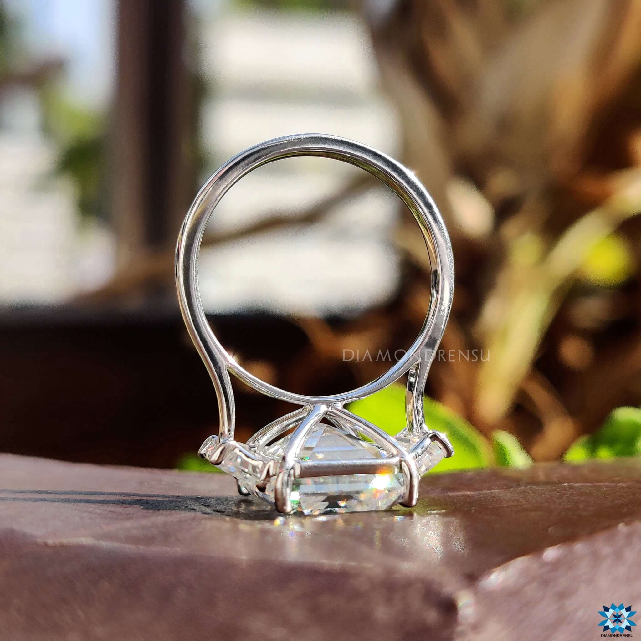 3 stone moissanite ring with prong setting.