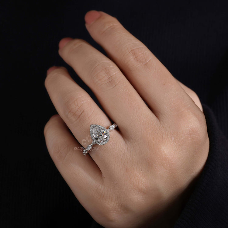 Halo ring ring featuring marquise and round side stones with a claw prong setting for maximum durability and beauty.