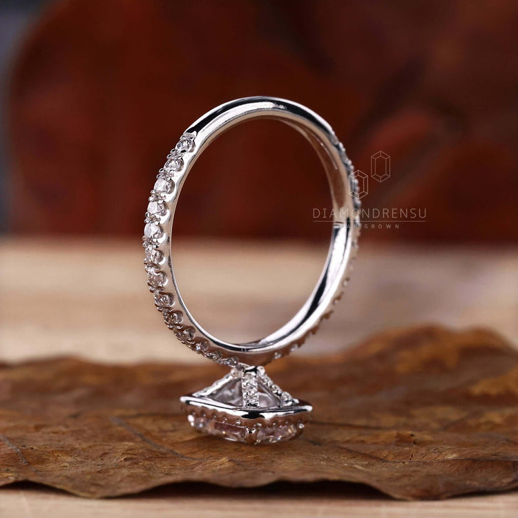 Halo ring setting with pave diamonds and radiant cut for a one-of-a-kind handmade ring experience.