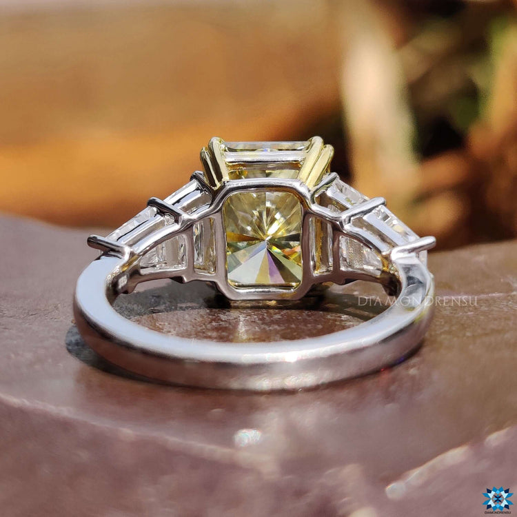 Yellow and white gold ring with five moissanites.