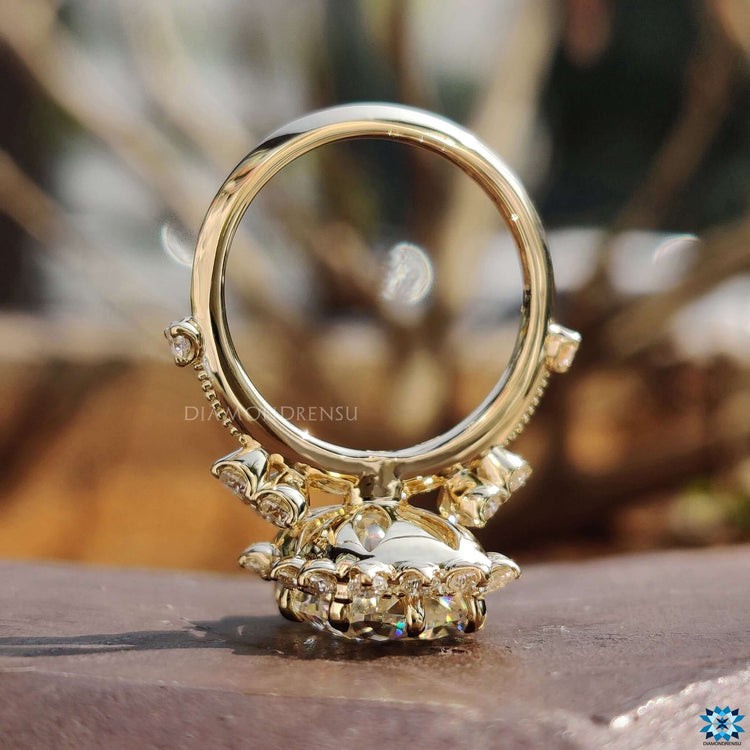 Tapered shank cushion cut ring in prong setting.