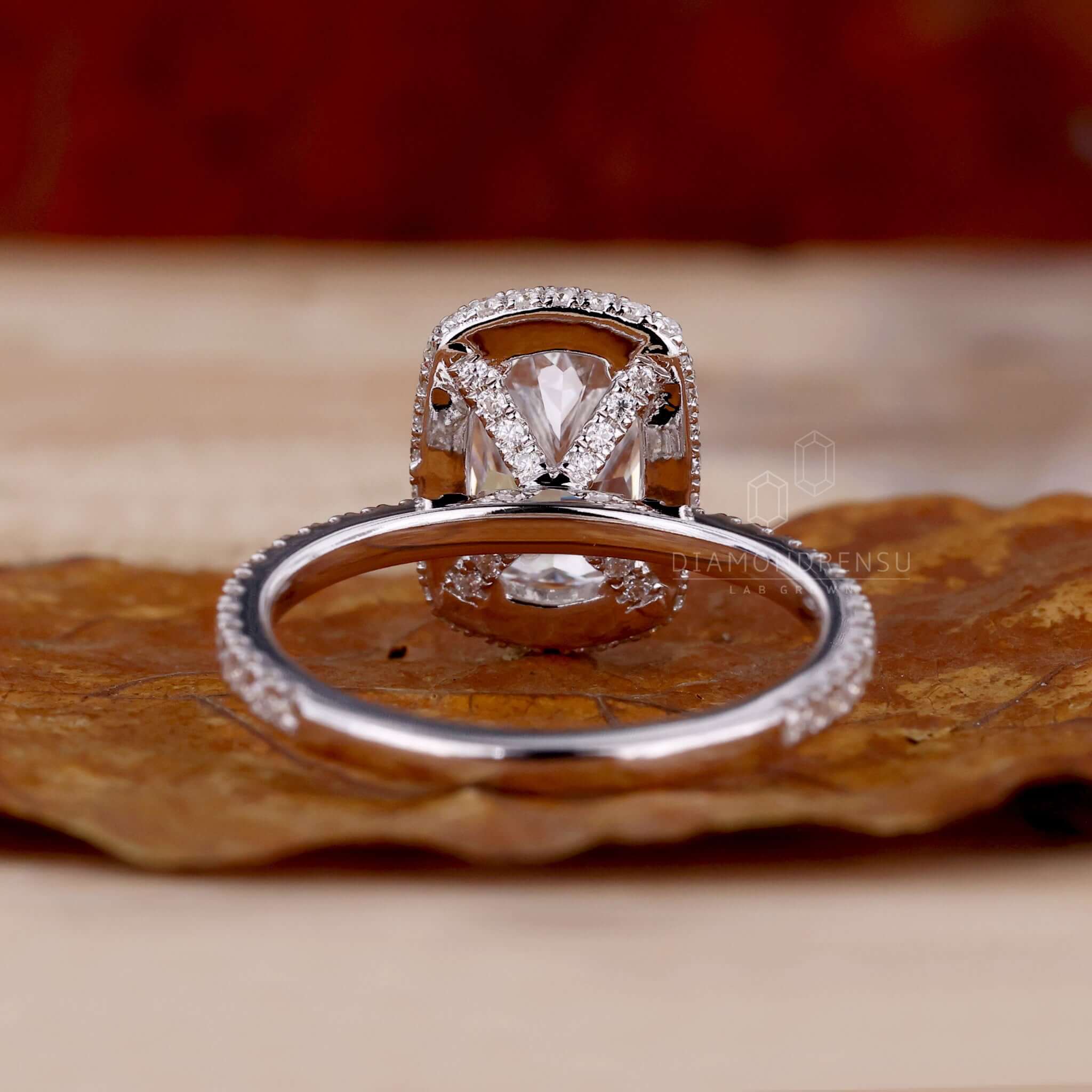 Cushion engagement ring with pave ring diamond accents in lab grown diamond design for eco-conscious buyers.