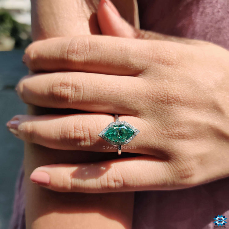 Custom cyan blue moissanite ring.