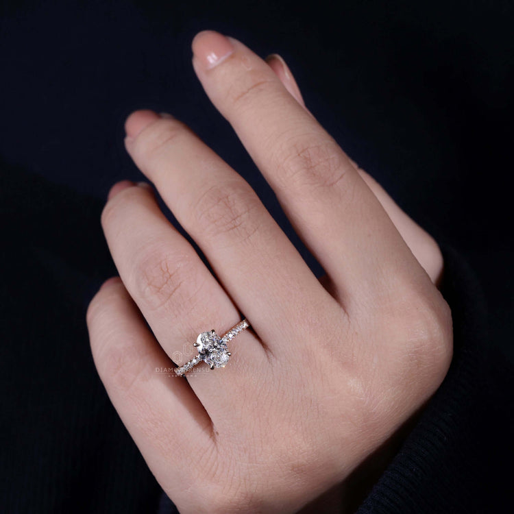 Oval engagement ring with hidden halo detailing, ideal for women seeking a unique engagement ring with style.