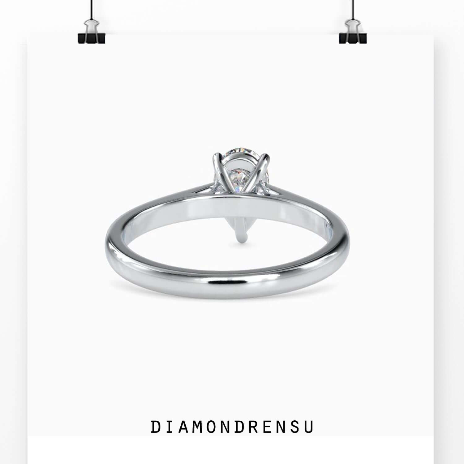 White gold prong set pear diamond ring for engagement.