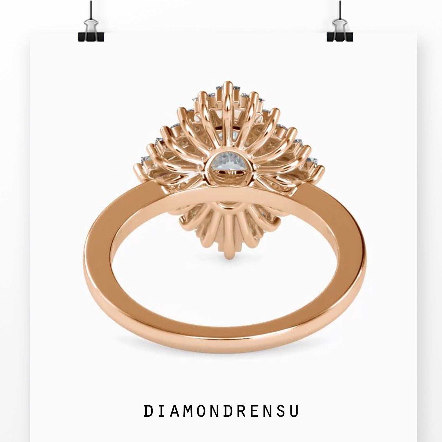 Round prong halo ring with baguette side diamonds.