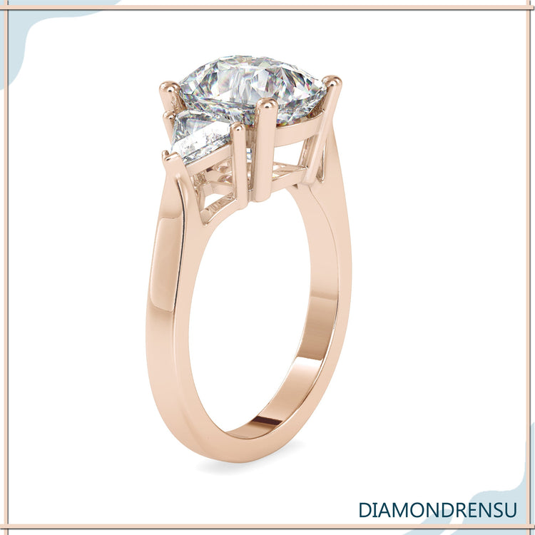 Lab diamond ring with three stone arrangement and prong mount.