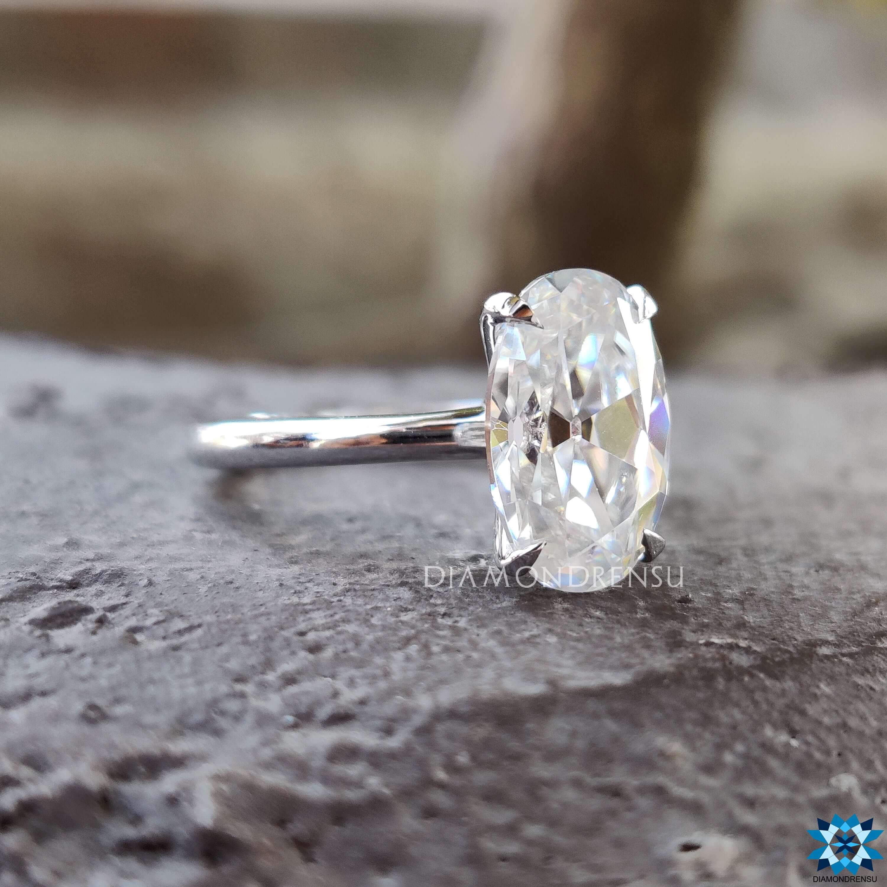 Handmade white gold ring featuring Moval old European cut moissanite.