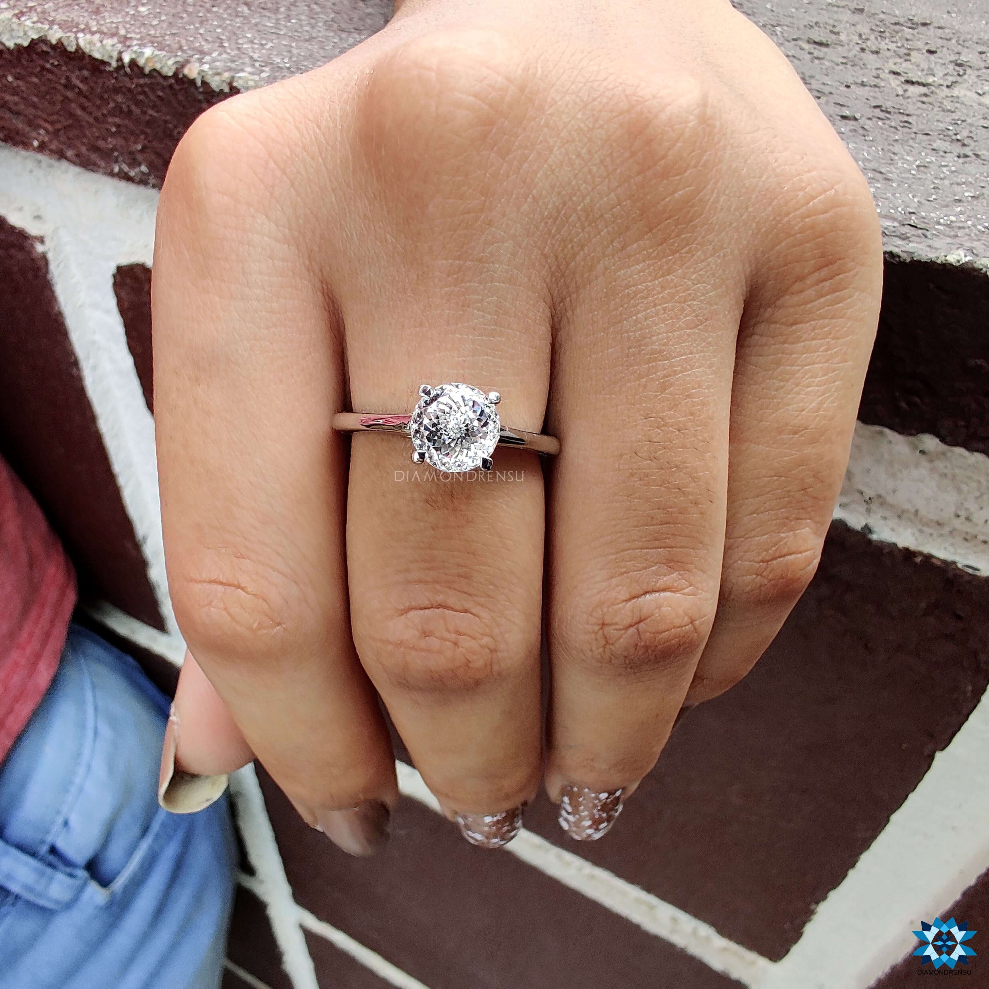 White gold ring with Portuguese cut moissanite center.