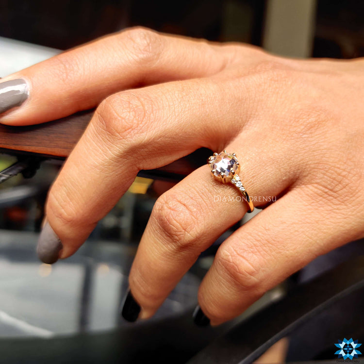 Diamondrensu UK ring with rose cut moissanite and round side accents.