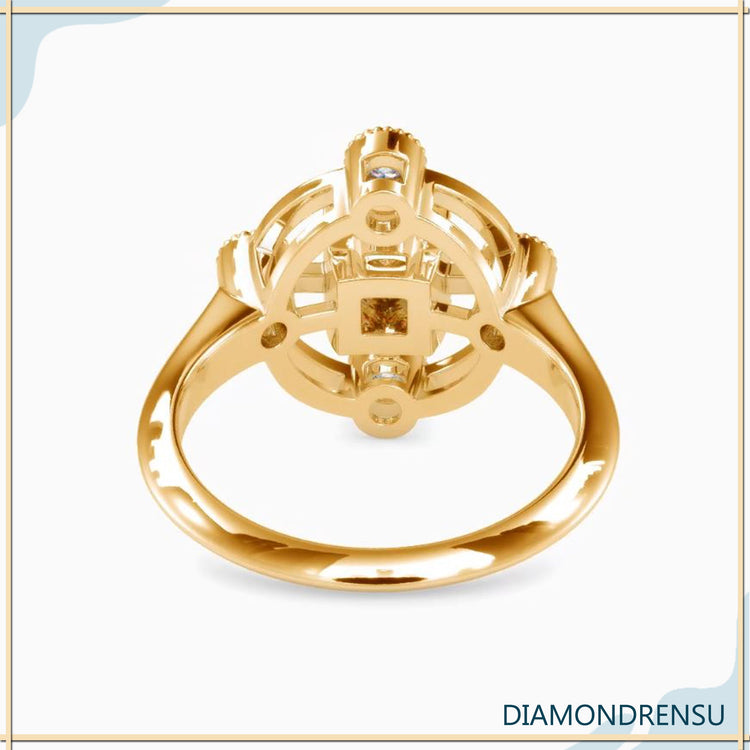 UK engagement ring with four round diamonds and princess cut.