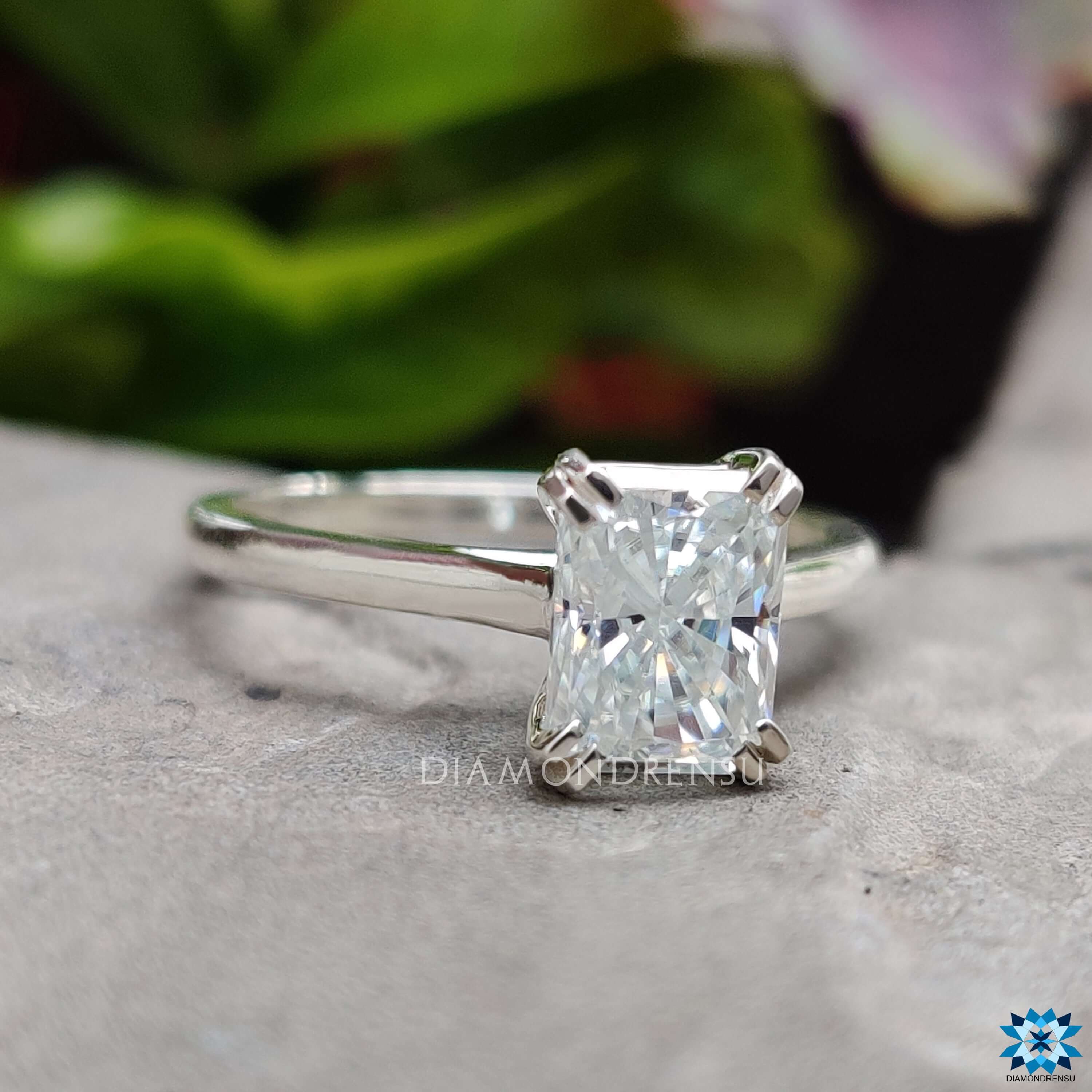 Elegant prong set radiant ring with cathedral mount.