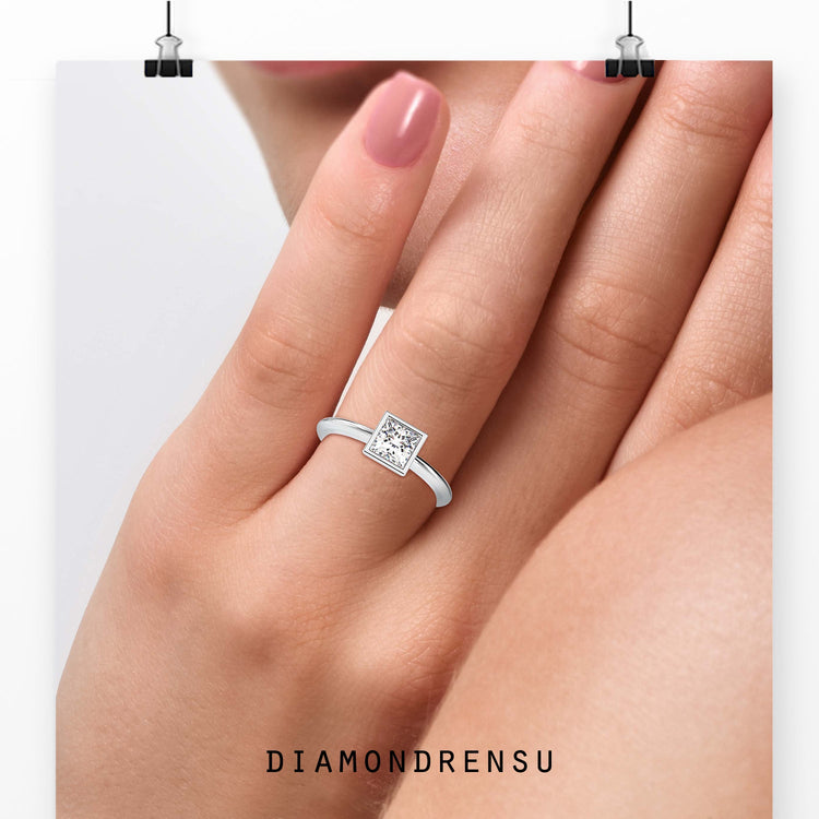 Lab grown princess diamond ring in rose gold bezel mount.